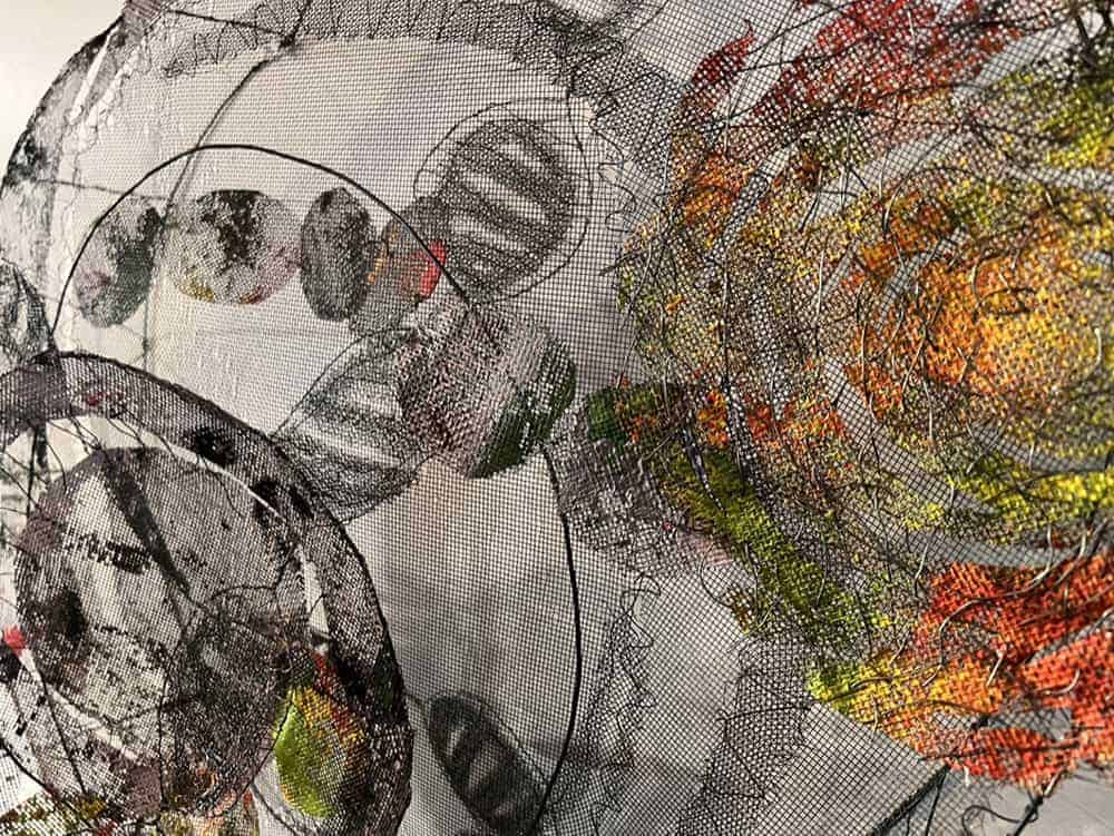 Abstract mixed media artwork with vibrant colors and textured elements.